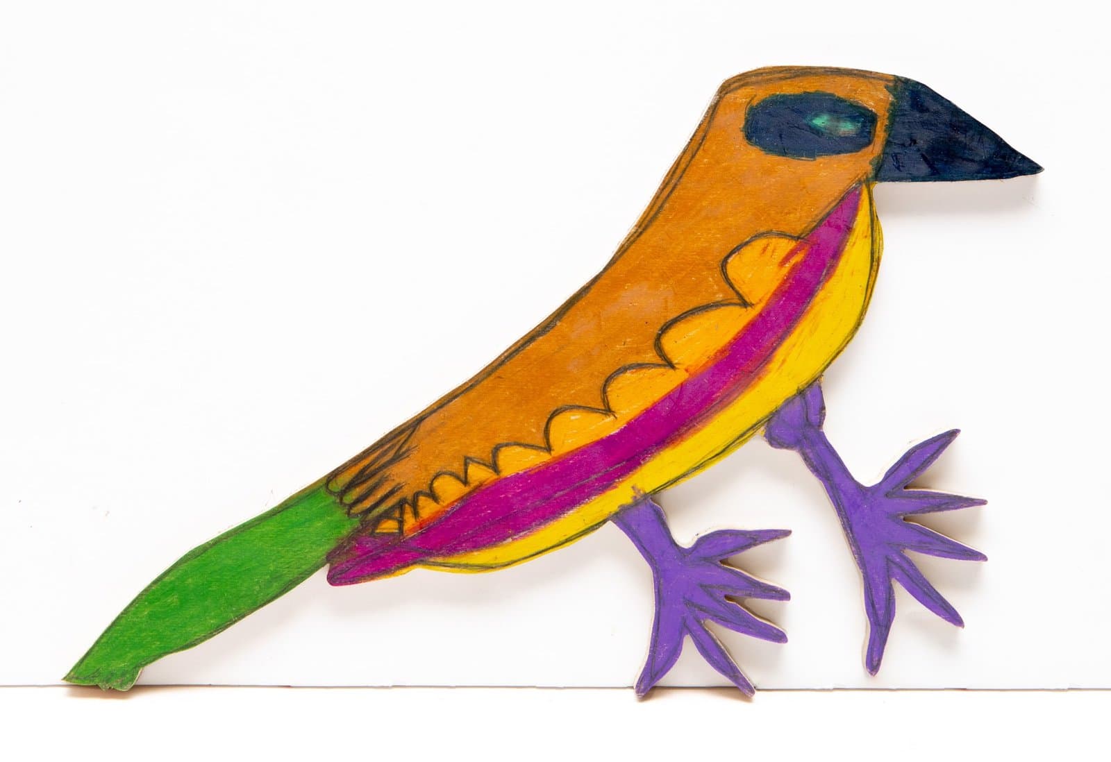 Cut-out wooden bird sculpture painted in bright orange, yellow, green, and purple with Prismastix.