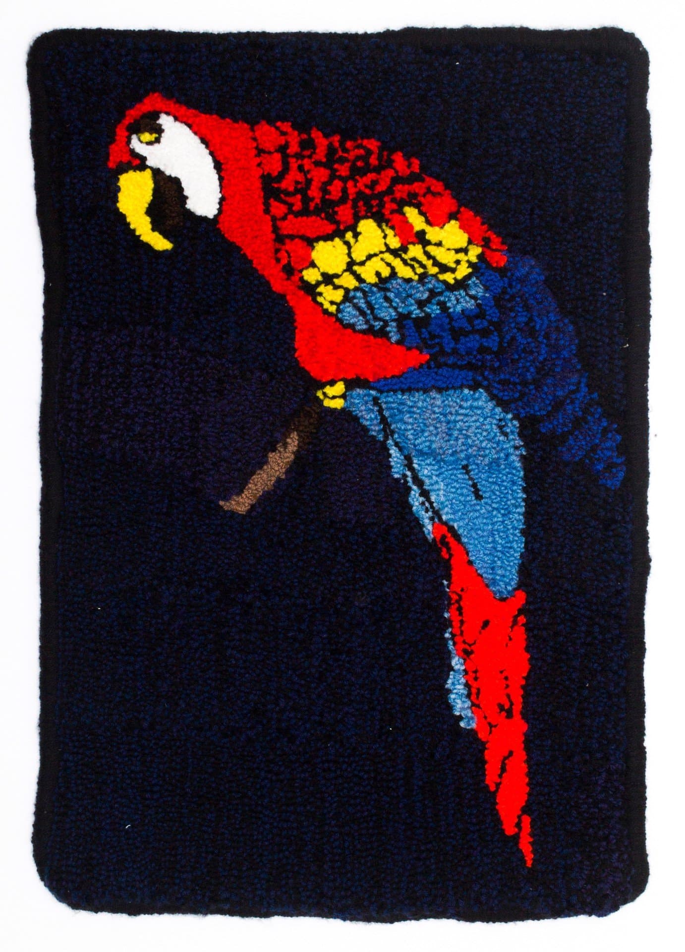 Hooked rug depicting a colorful parrot in profile on dark blue background