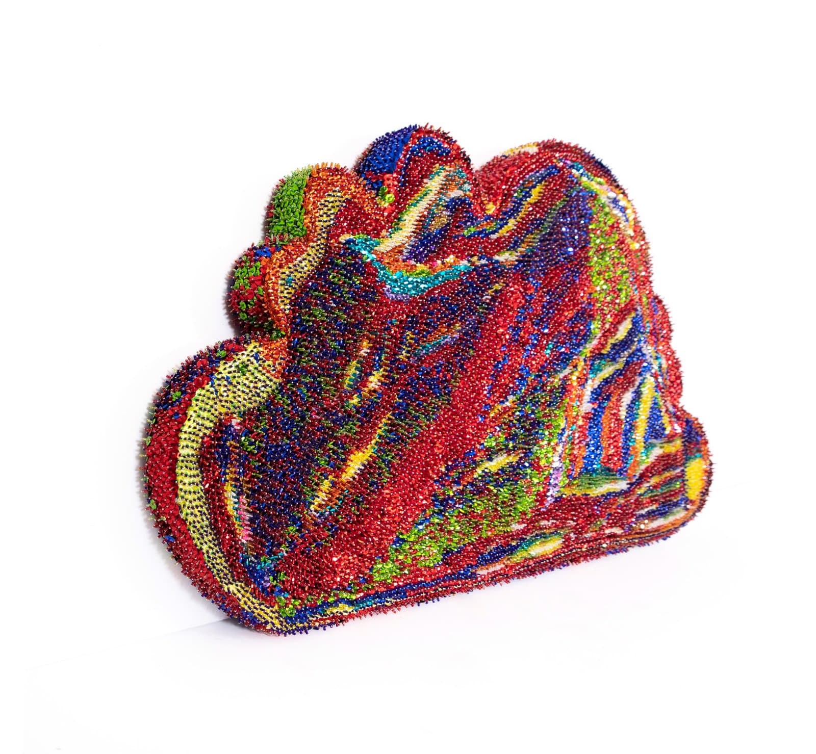 Sculptural object covered in multicolored sequins arranged in swirling patterns on styrofoam base.