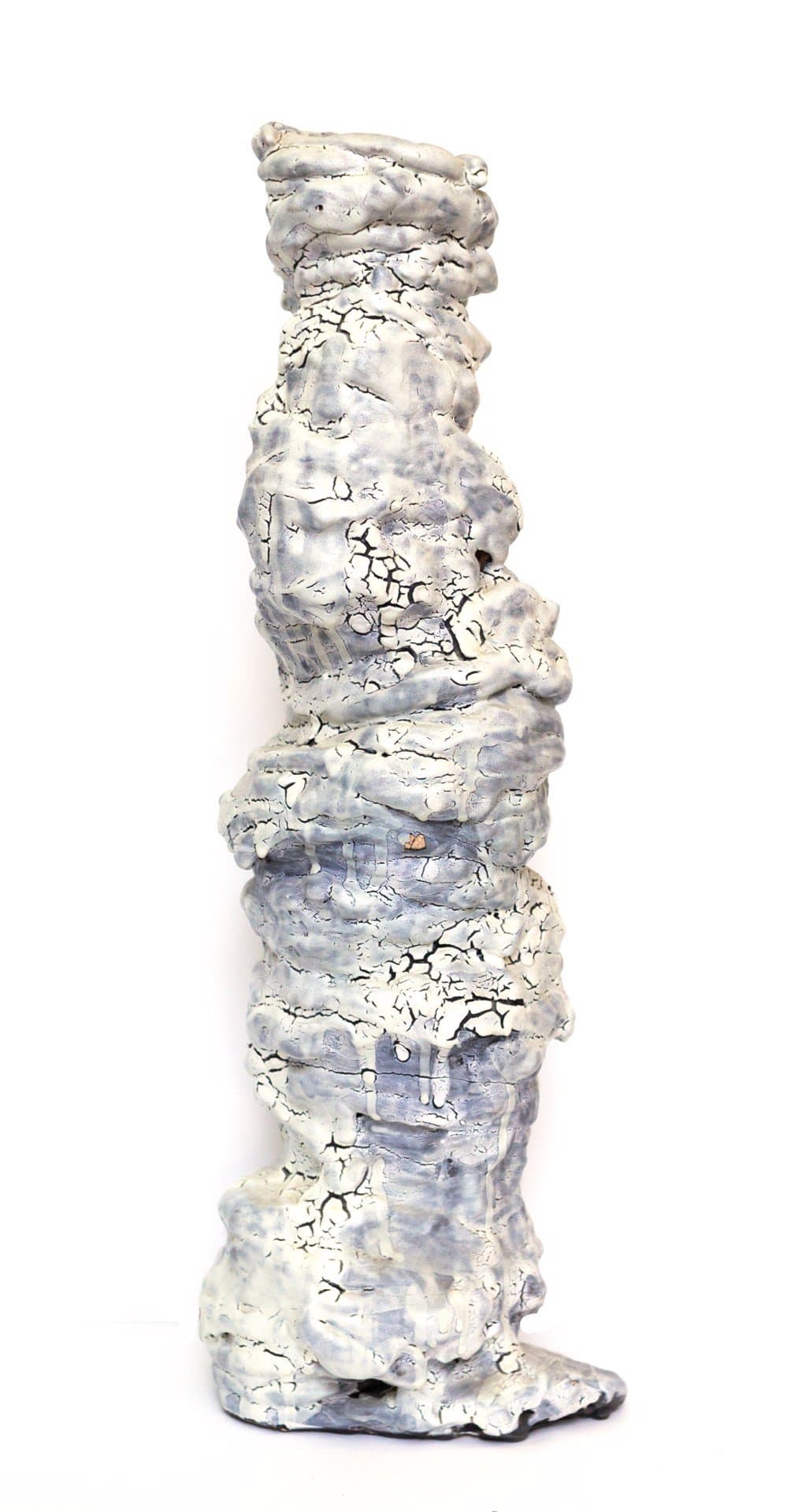Ceramic sculpture: tall twisted column with cracked white and gray glazed surface, roughly textured