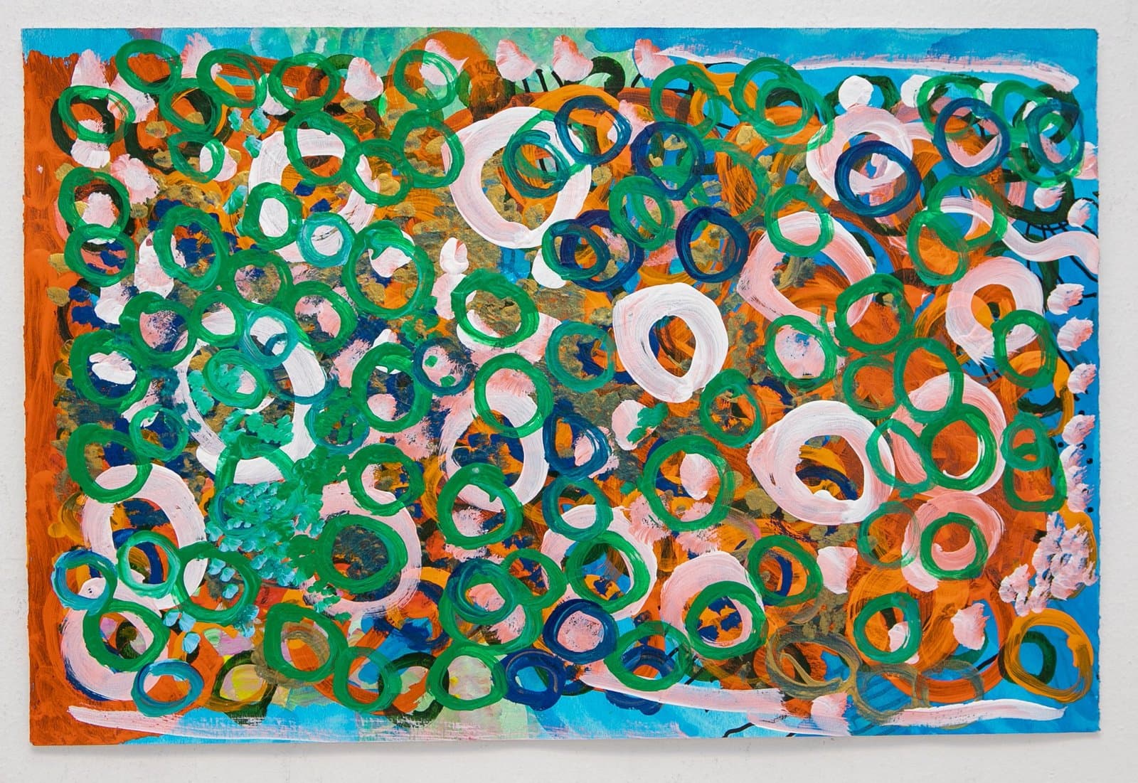 Abstract painting with densely overlapping circular forms in green, pink, orange, and blue acrylic on paper.