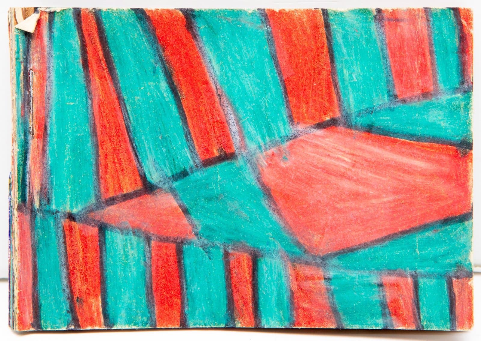 Small book with pastel drawing of interior seating area in bright turquoise and coral colors on paper.