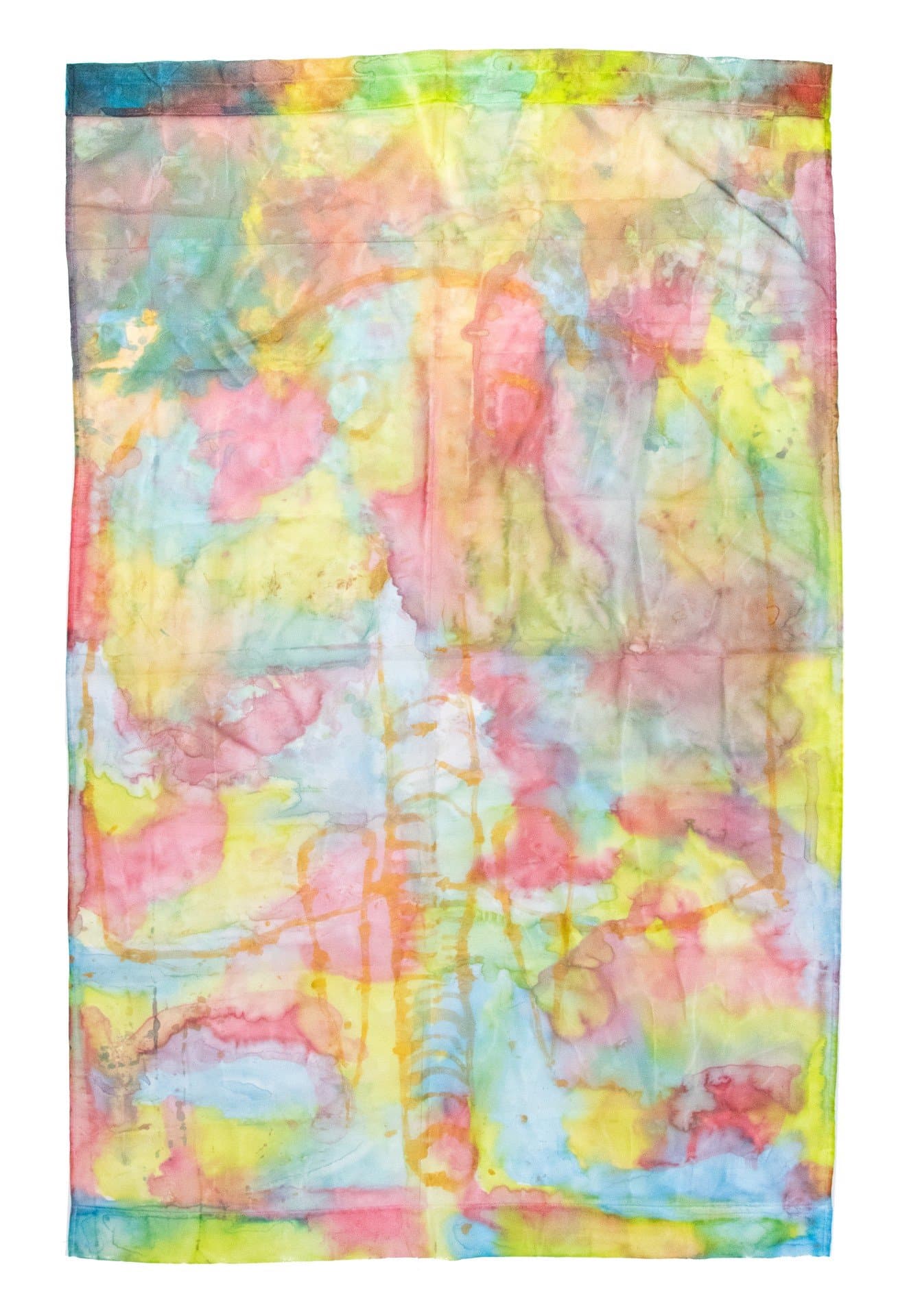 Abstract textile artwork with vibrant watercolor-like washes in pink, yellow, blue, and green with visible fold lines