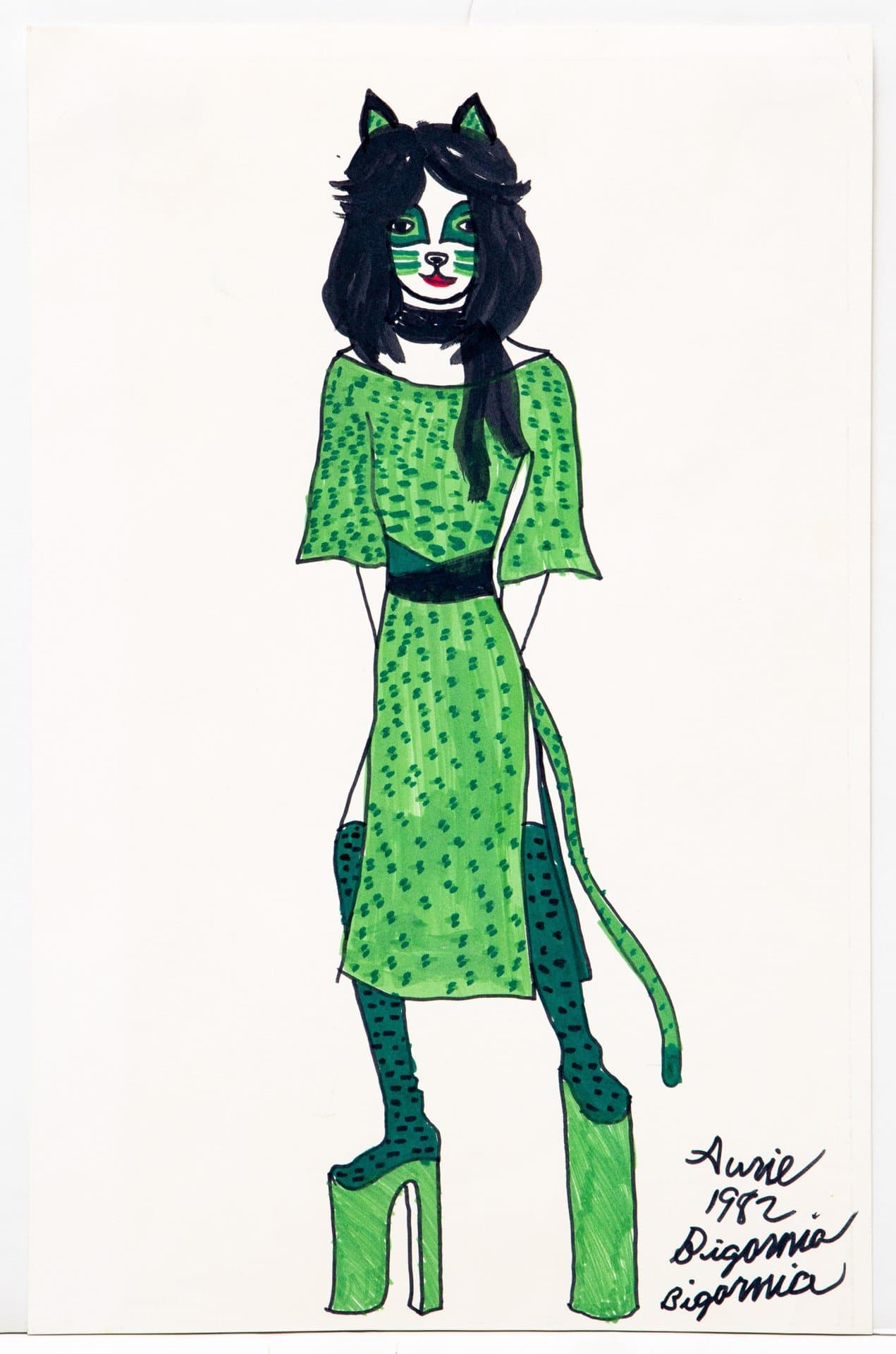 Ink drawing of anthropomorphic cat figure in green patterned dress and platform shoes on white paper