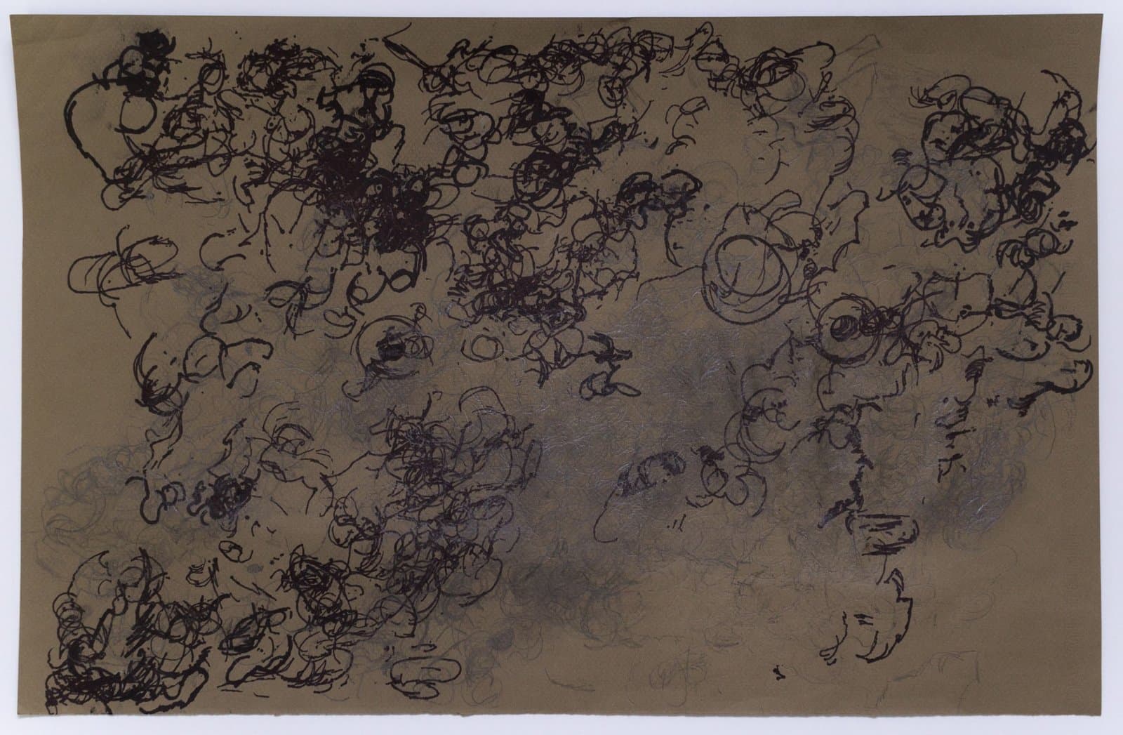Abstract drawing with chaotic black ink scribbles and gestural marks on tan paper