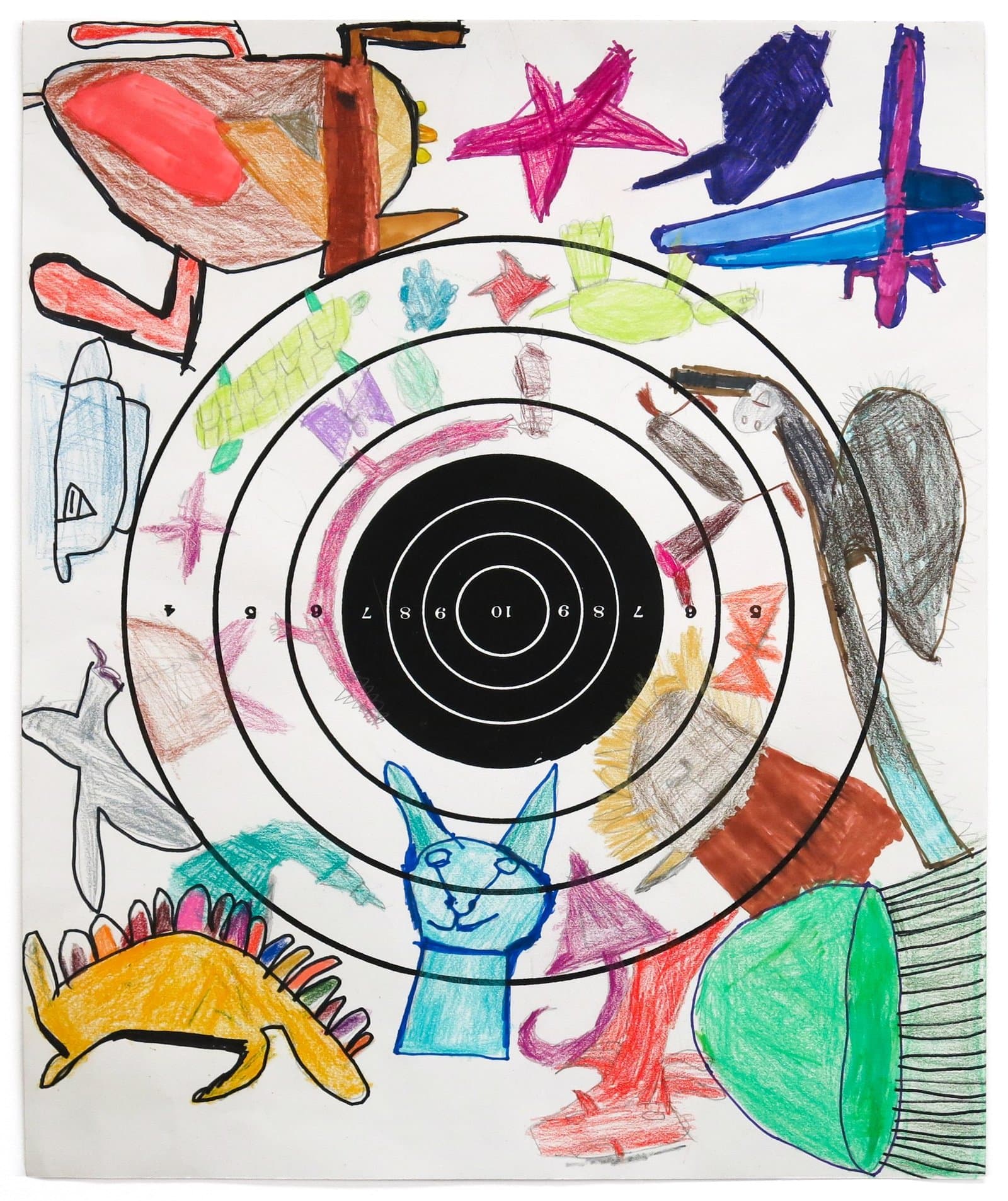Mixed media drawing with central black bullseye target surrounded by colorful shapes, animals, and objects on white paper.