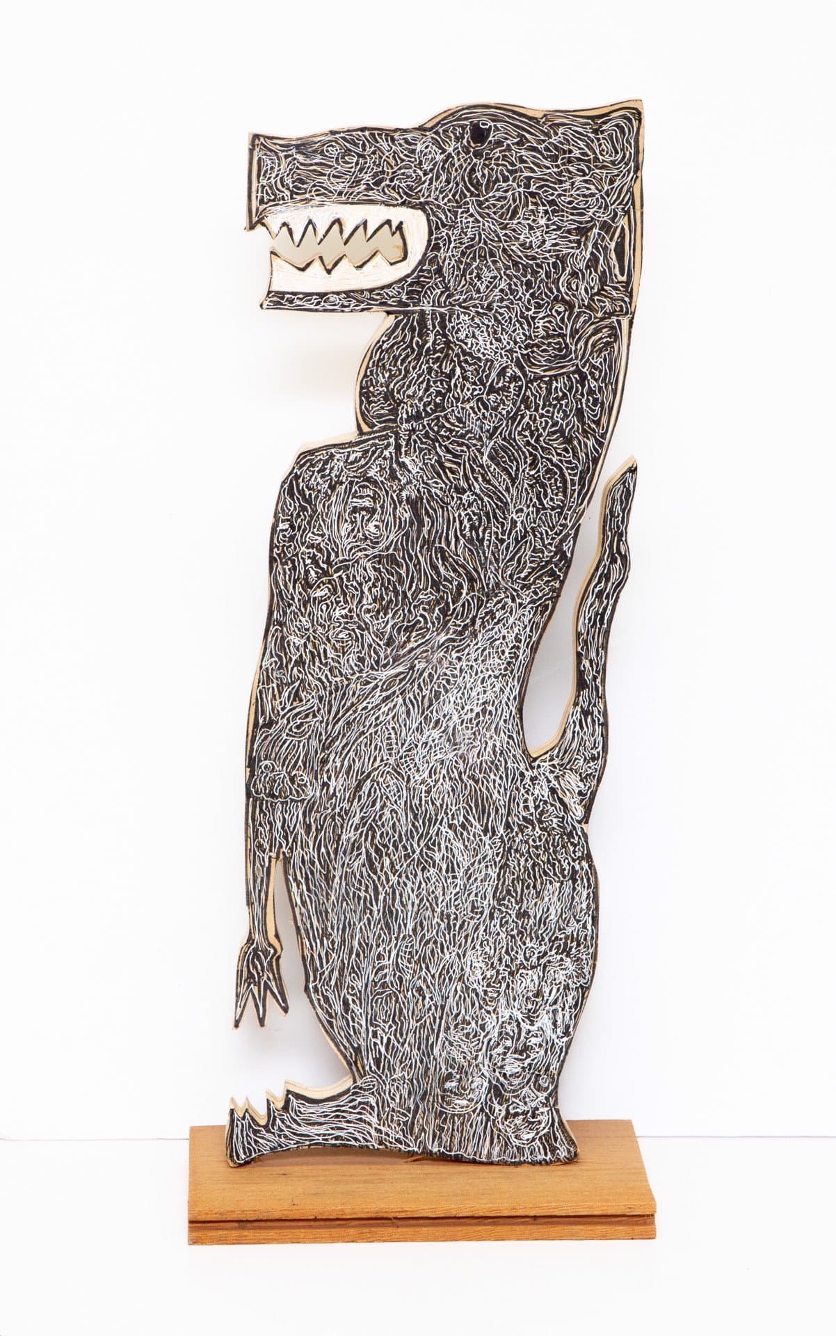 Standing wolf sculpture in acrylic on wood with intricate linear patterns covering the form, mounted on wooden base.